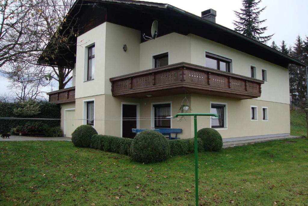 a large house with a balcony on top of it at Maria Aichholzer in Sankt Jakob im Rosental