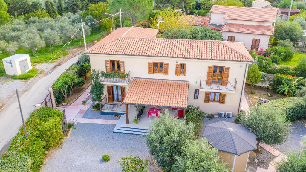 an aerial view of a house with an umbrella at B&B Le Dune - Self Check in in Lascari
