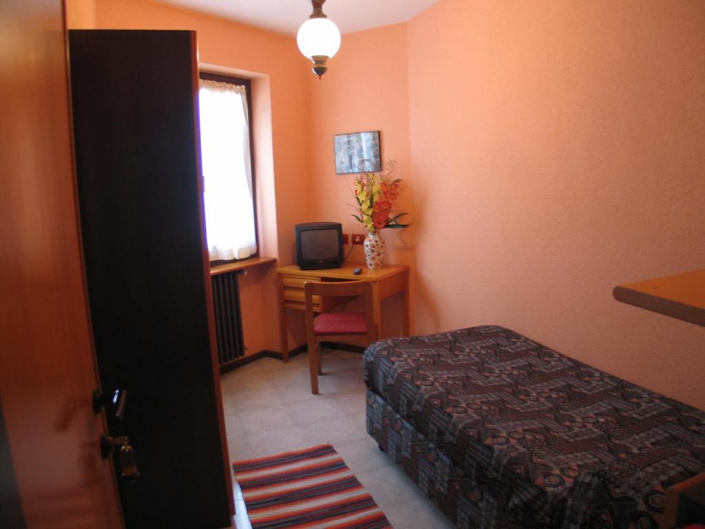 Postel nebo postele na pokoji v ubytování Hotel La Lanterna
