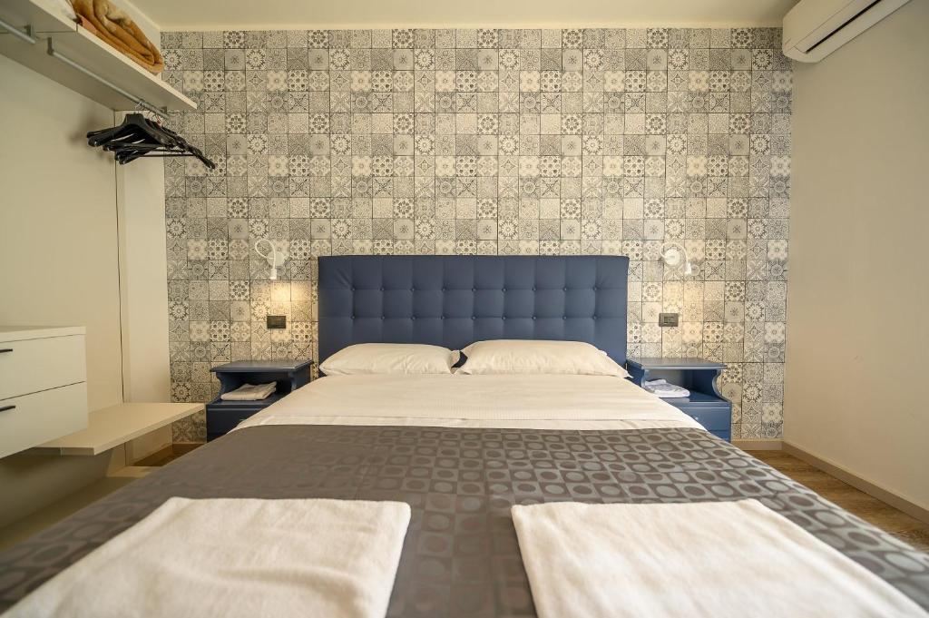 Postel nebo postele na pokoji v ubytování Hotel & Apartments " Perpoin "