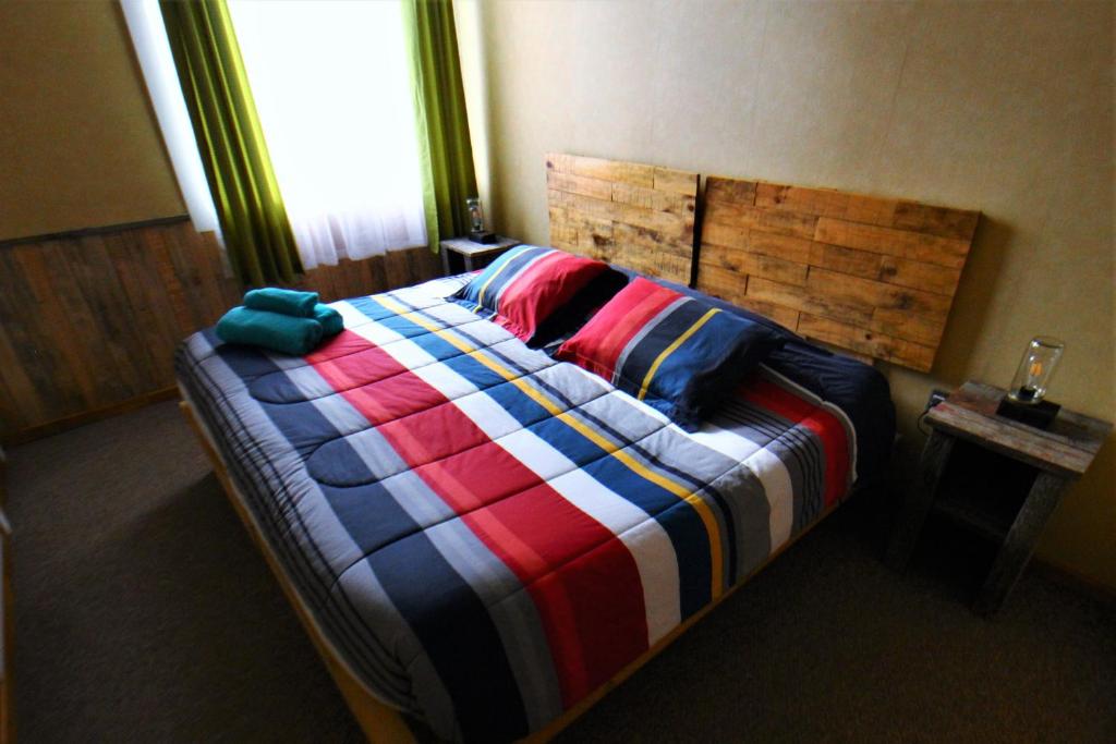 Postel nebo postele na pokoji v ubytování Corner Hostel Puerto Natales