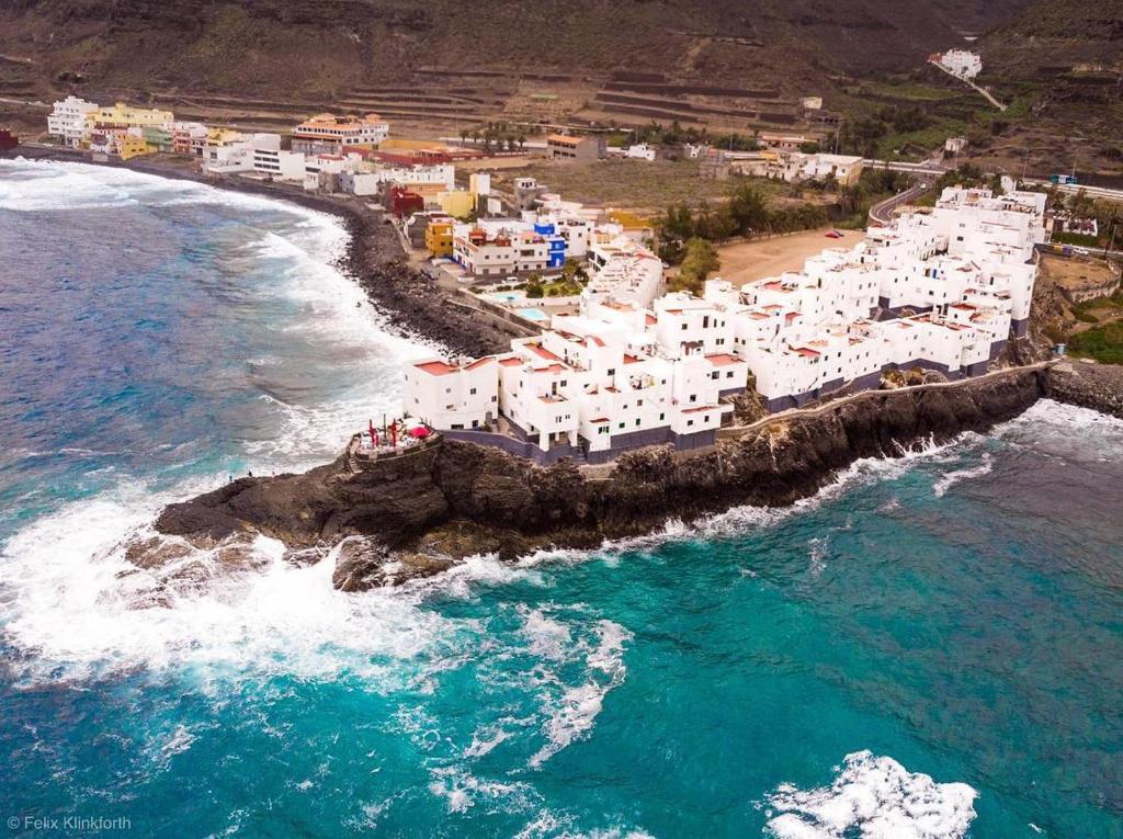 an aerial view of a beach with white buildings at Mary's Home in Moya