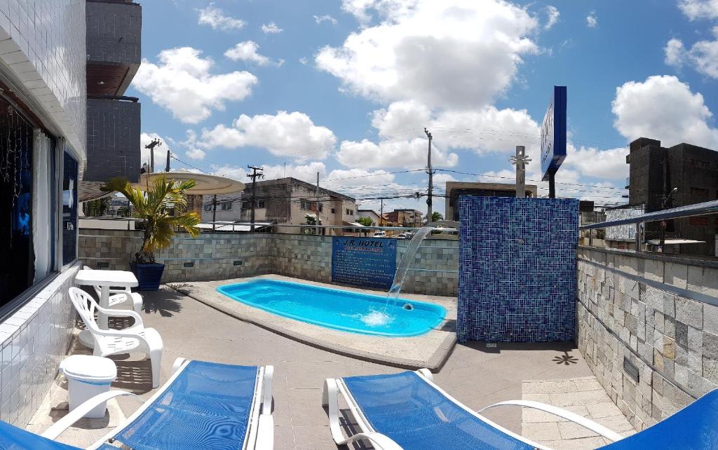 a swimming pool on the roof of a building at JR Hotel in João Pessoa