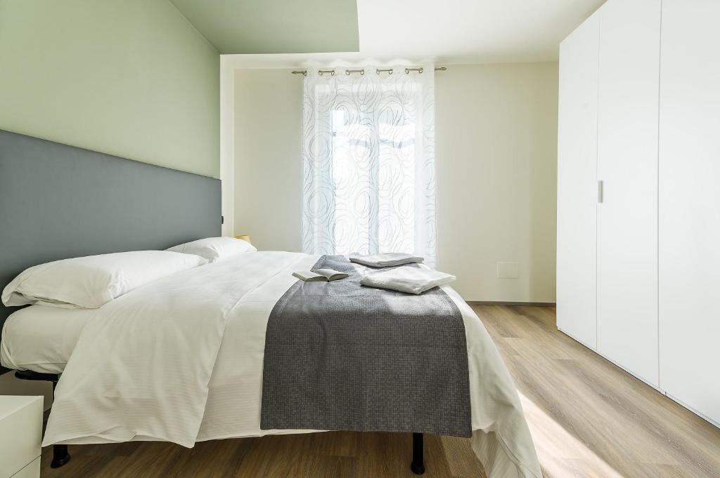 Postel nebo postele na pokoji v ubytování Hotel & Apartments " Perpoin "