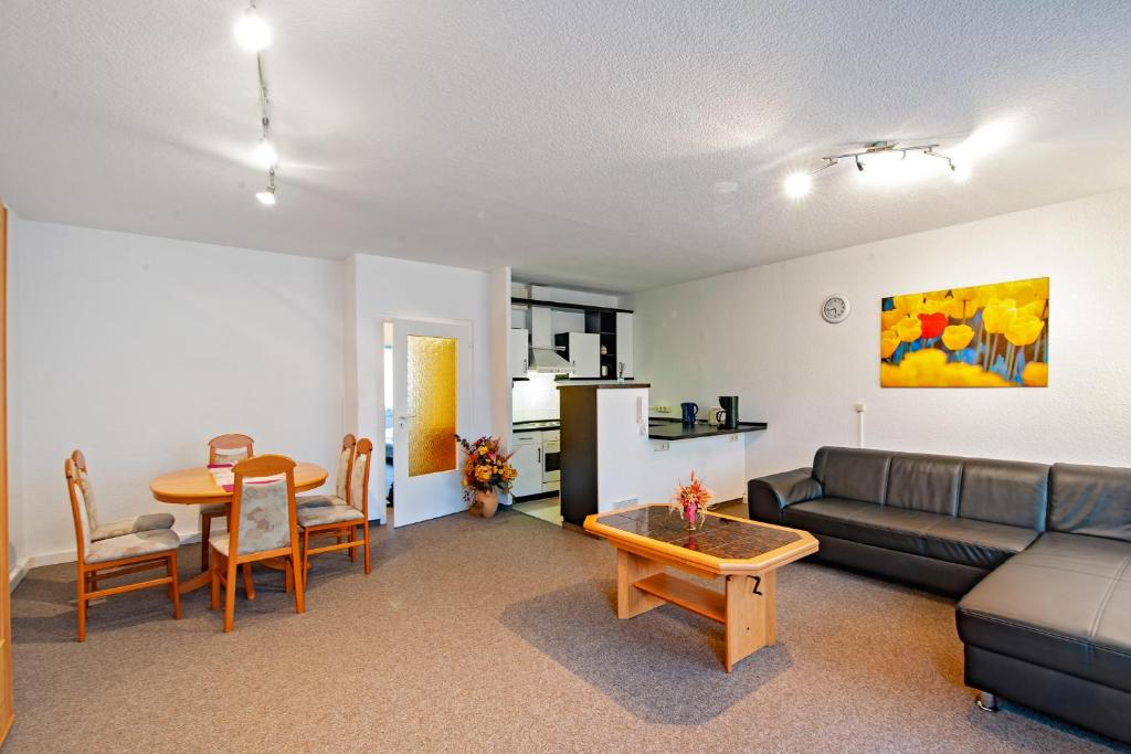 a living room with a couch and a table at Ferienwohnung 143 in Annaberg-Buchholz