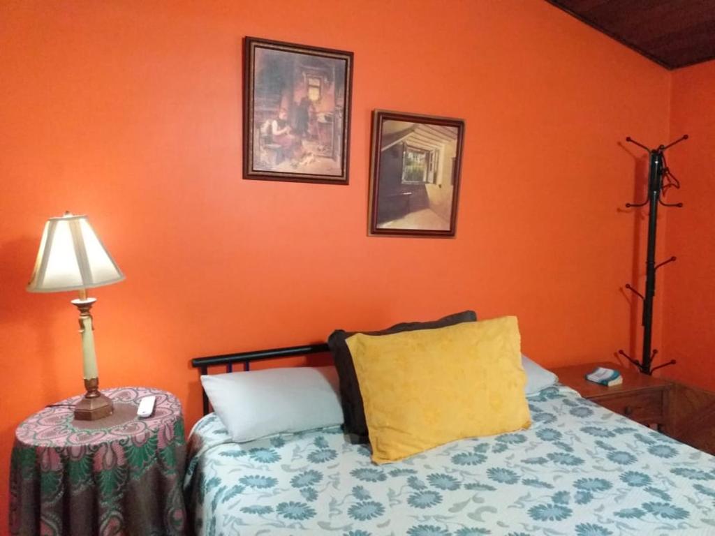 מיטה או מיטות בחדר ב-Casa Posada Amelia