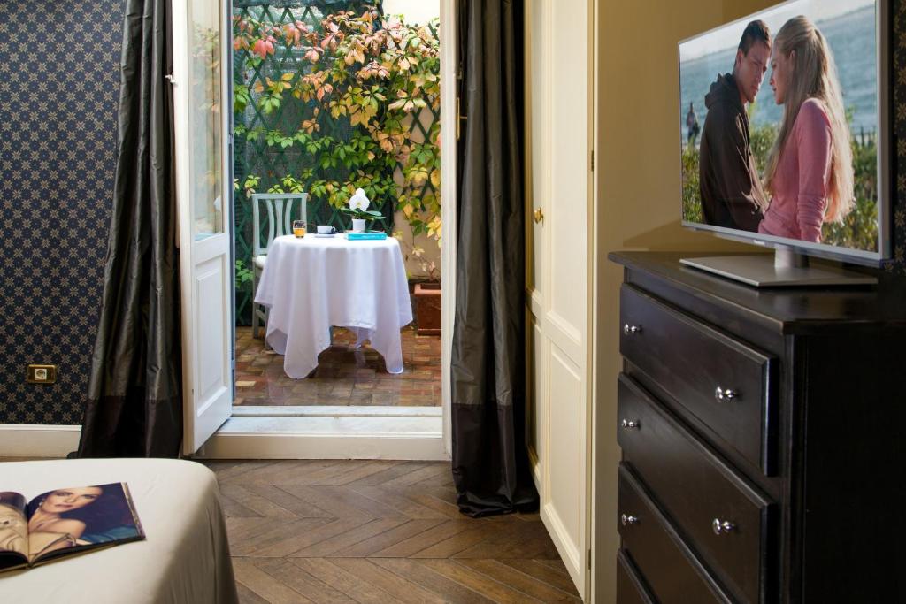 TV a/nebo společenská místnost v ubytování Boutique Hotel Anahi