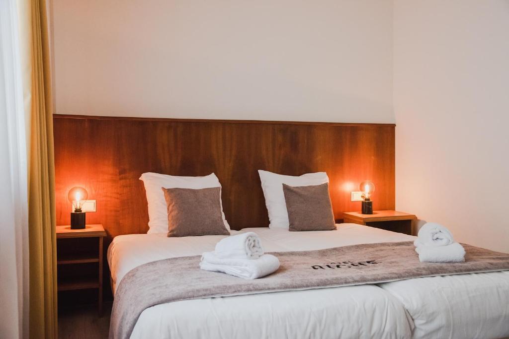 Postel nebo postele na pokoji v ubytování Hotel Riche