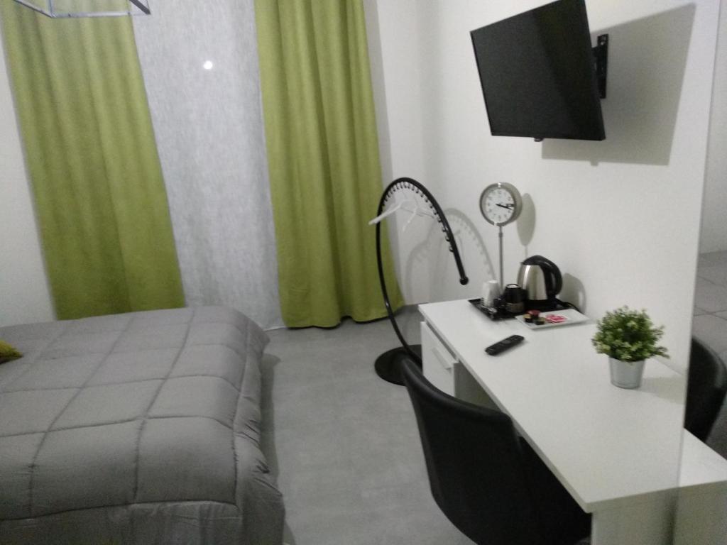 Televízia a/alebo spoločenská miestnosť v ubytovaní B&B Giovaldi's Torino