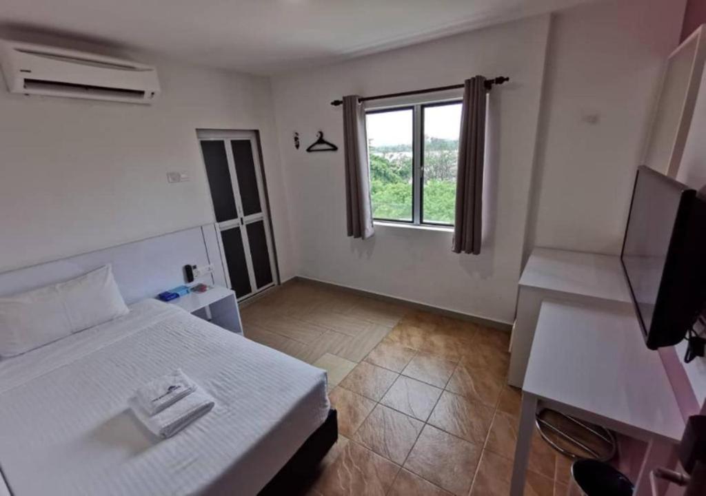 Postel nebo postele na pokoji v ubytování Yew Boutique Hotel