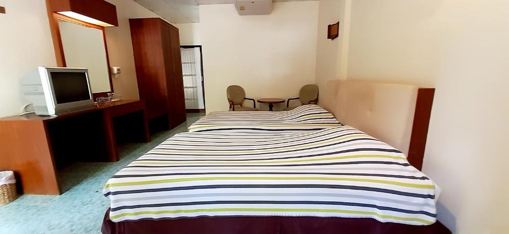 Postel nebo postele na pokoji v ubytování Rai Win Resort