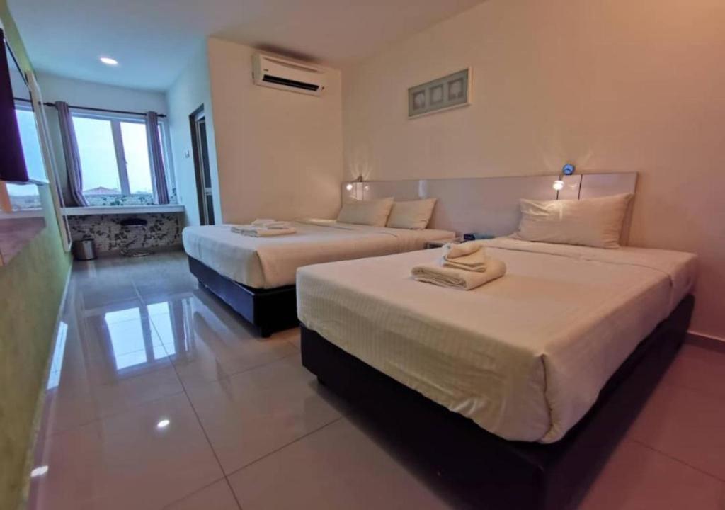 Postel nebo postele na pokoji v ubytování Yew Boutique Hotel