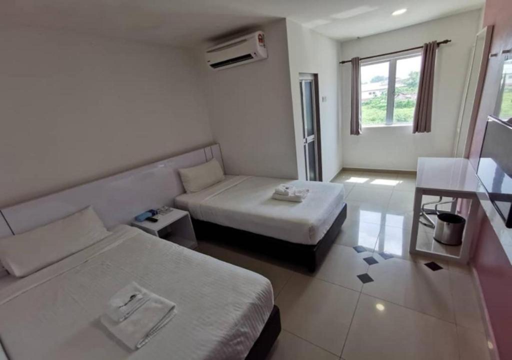 Postel nebo postele na pokoji v ubytování Yew Boutique Hotel