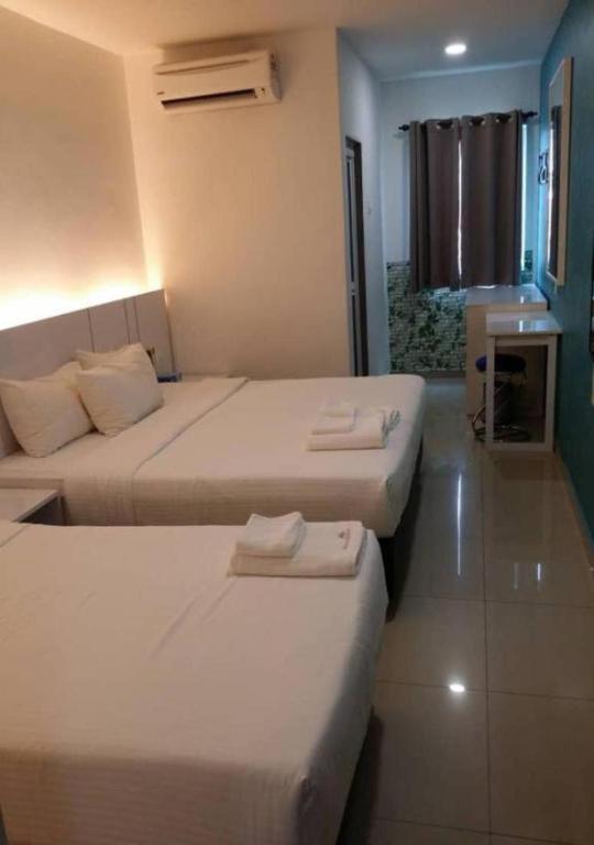 Postel nebo postele na pokoji v ubytování Yew Boutique Hotel