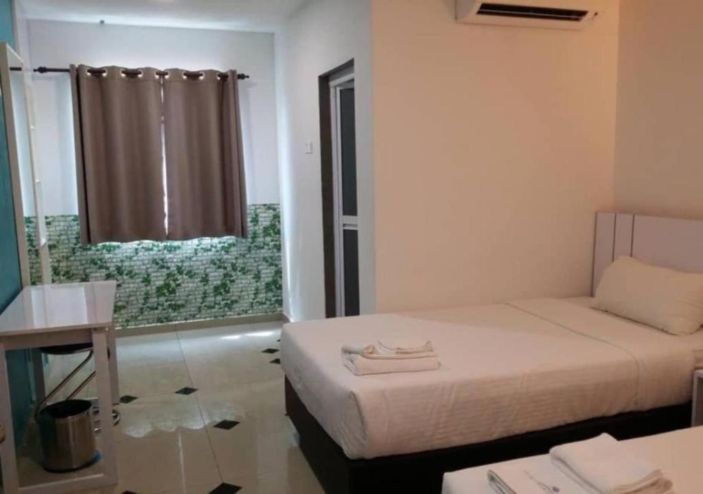 Postel nebo postele na pokoji v ubytování Yew Boutique Hotel