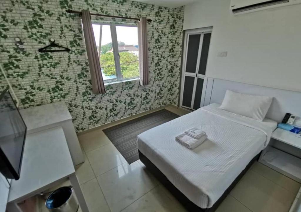 Postel nebo postele na pokoji v ubytování Yew Boutique Hotel