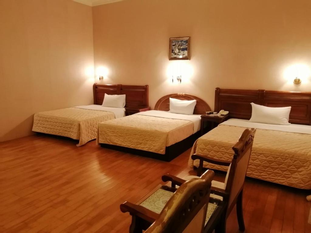 Postel nebo postele na pokoji v ubytování Di Bao Motel