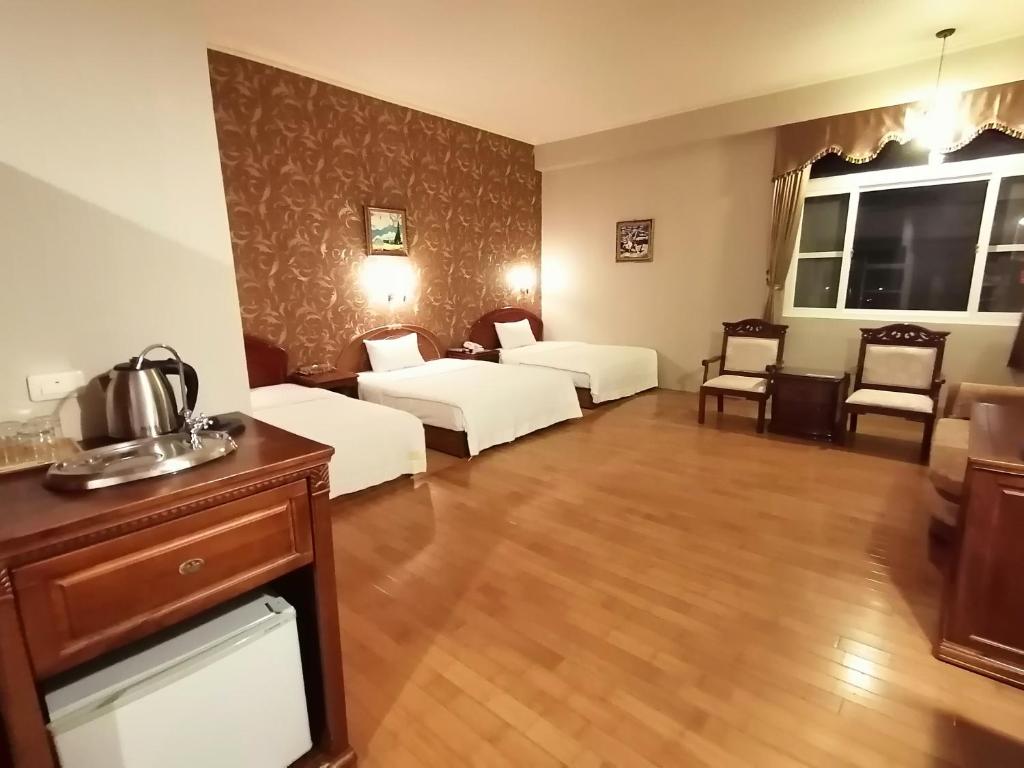 Postel nebo postele na pokoji v ubytování Di Bao Motel