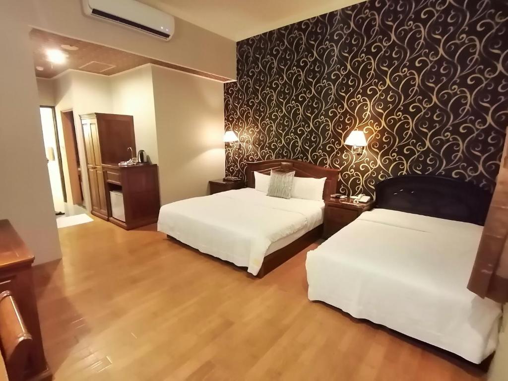 Postel nebo postele na pokoji v ubytování Di Bao Motel