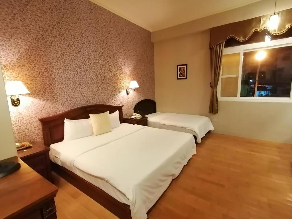 Postel nebo postele na pokoji v ubytování Di Bao Motel