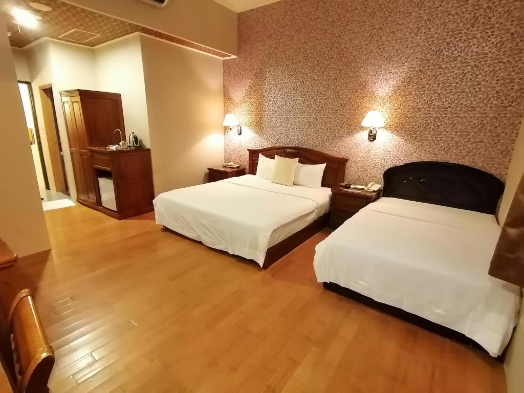 Postel nebo postele na pokoji v ubytování Di Bao Motel