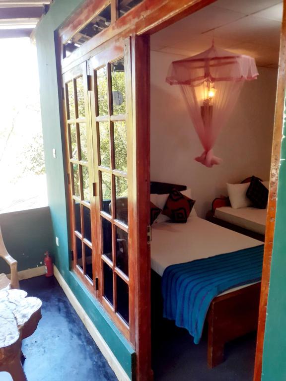 Postel nebo postele na pokoji v ubytování Chamathka homestay