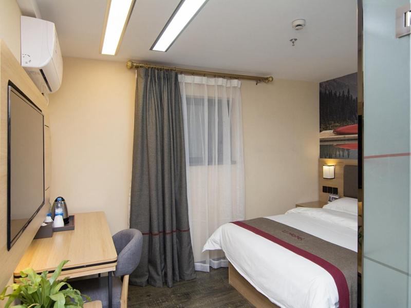 Postel nebo postele na pokoji v ubytování Thank Inn Plus Hotel Shanghai Qingpu District Hongqiao National Exhibition Center Xujing North City