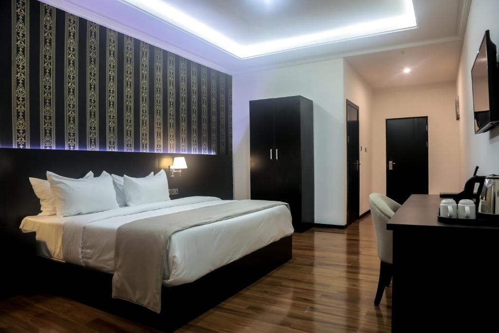 Postel nebo postele na pokoji v ubytování BON Hotel Ikeja Residence