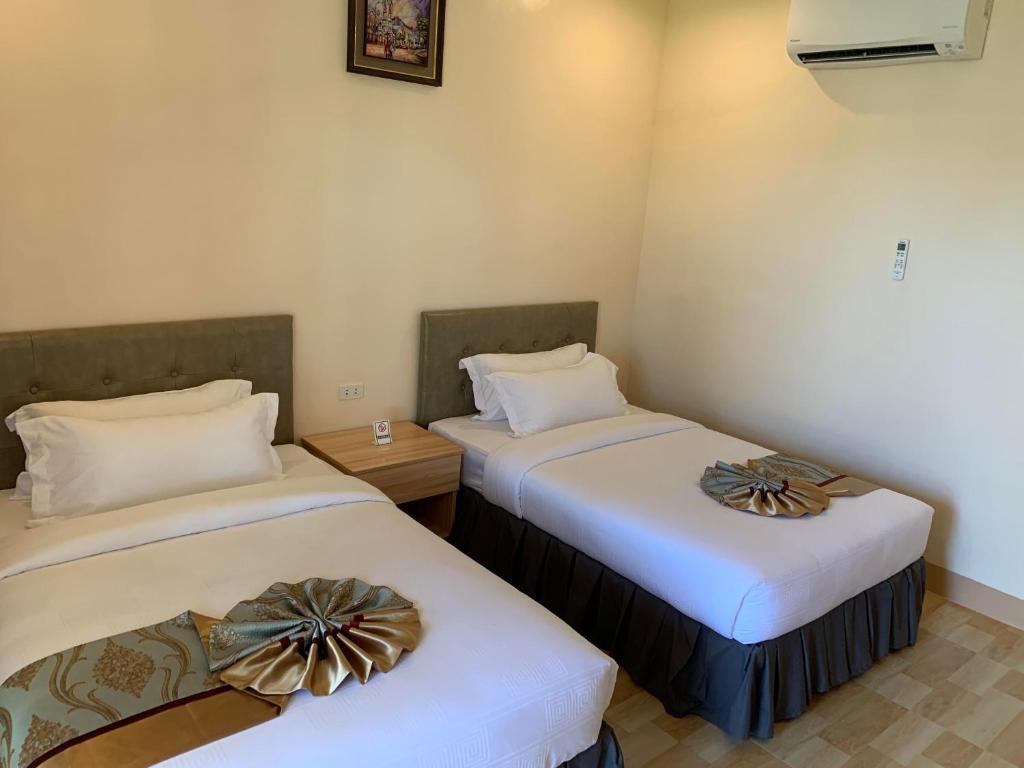 Letto o letti in una camera di Camotes Ocean Heaven Resort