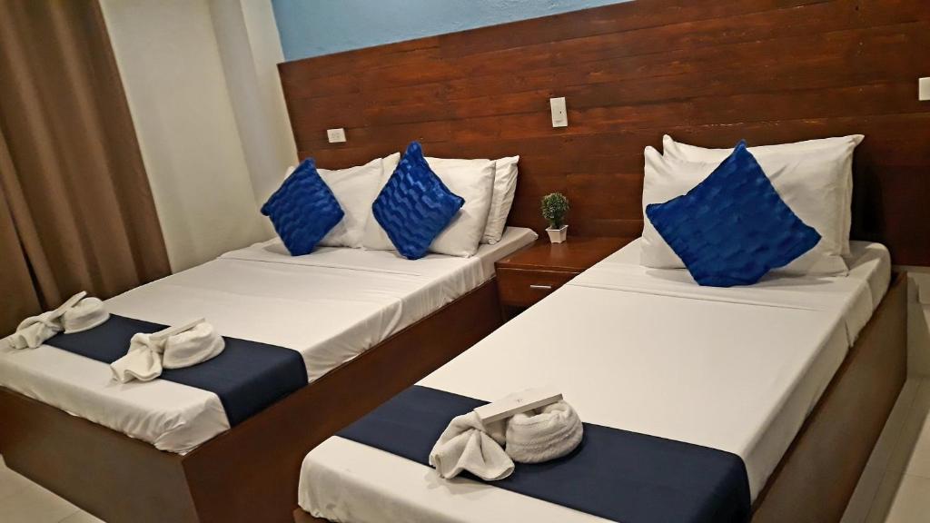 Cama o camas de una habitación en A&A ABE BAYFRONT INN