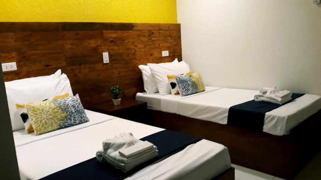 Cama o camas de una habitación en A&A ABE BAYFRONT INN