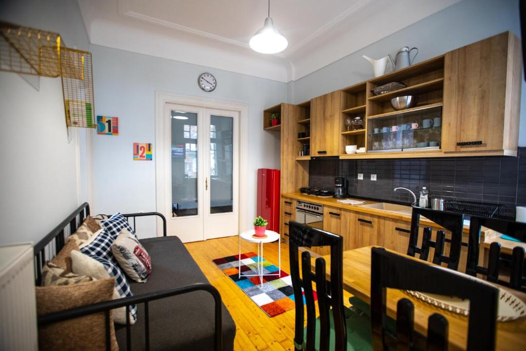 a kitchen with a table and a dining room at Ministry Mansion (SKG) in Thessaloniki