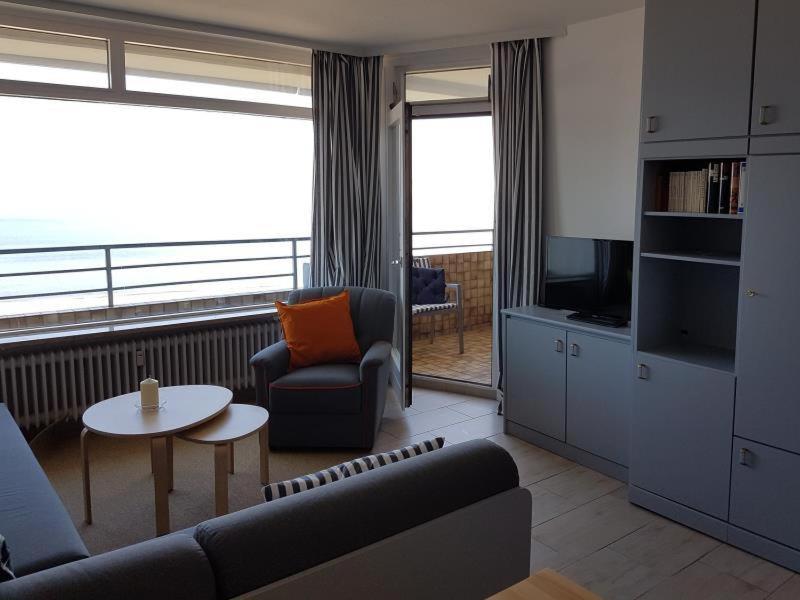 a living room with a couch and a table at Strandhotel Wohnung 62 in Dahme
