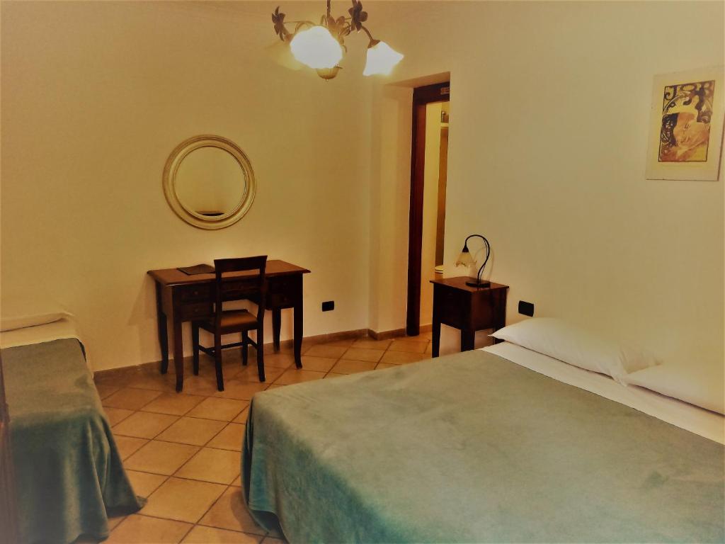 Postel nebo postele na pokoji v ubytování Hotel Pace