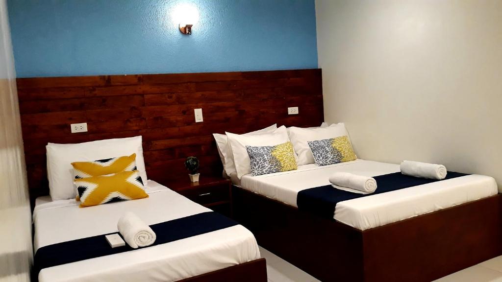 Cama o camas de una habitación en A&A ABE BAYFRONT INN