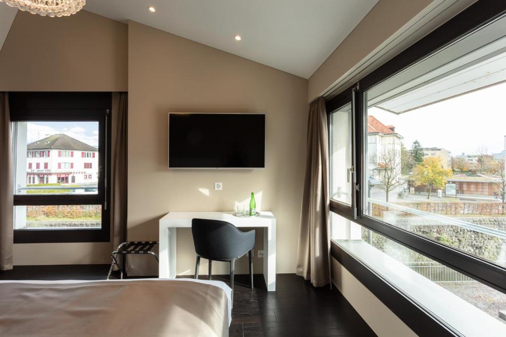 Postel nebo postele na pokoji v ubytování Hotel Lo! im Kreuz Jona