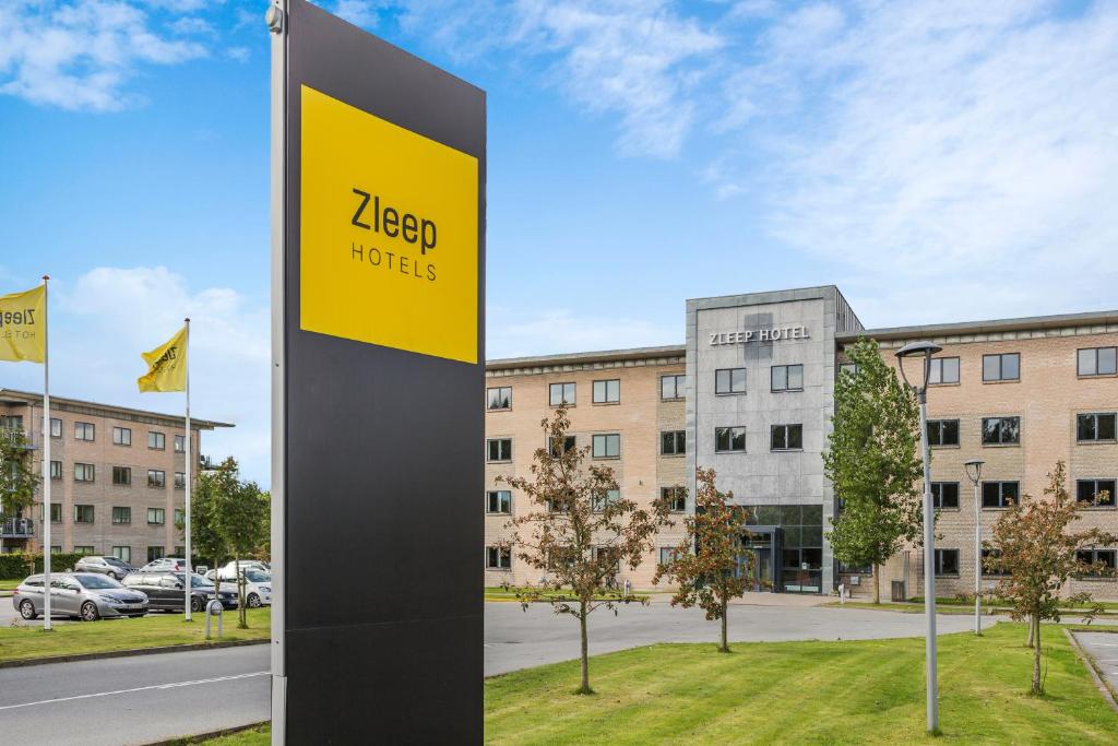 a sign for a hotel in front of a building at Zleep Hotel Ballerup in Ballerup
