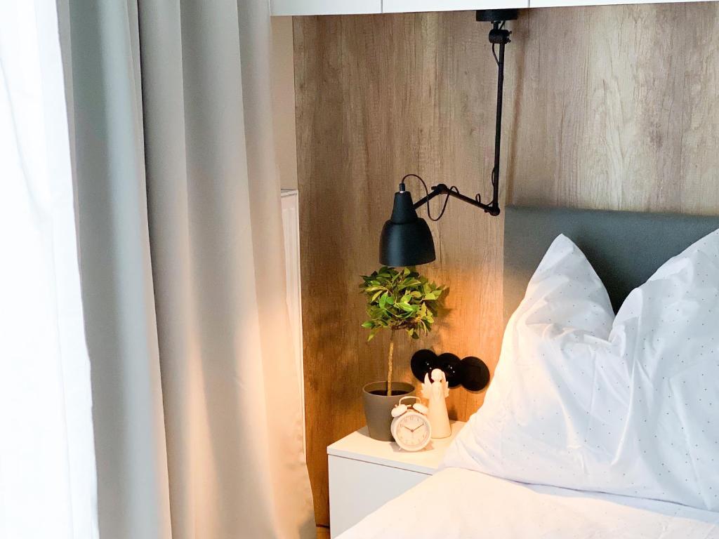 Posteľ alebo postele v izbe v ubytovaní ONE Apartamenty Gąsiorowskich 4