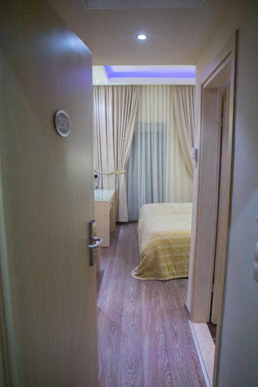 Postel nebo postele na pokoji v ubytování Pantelidis Hotel & Spa