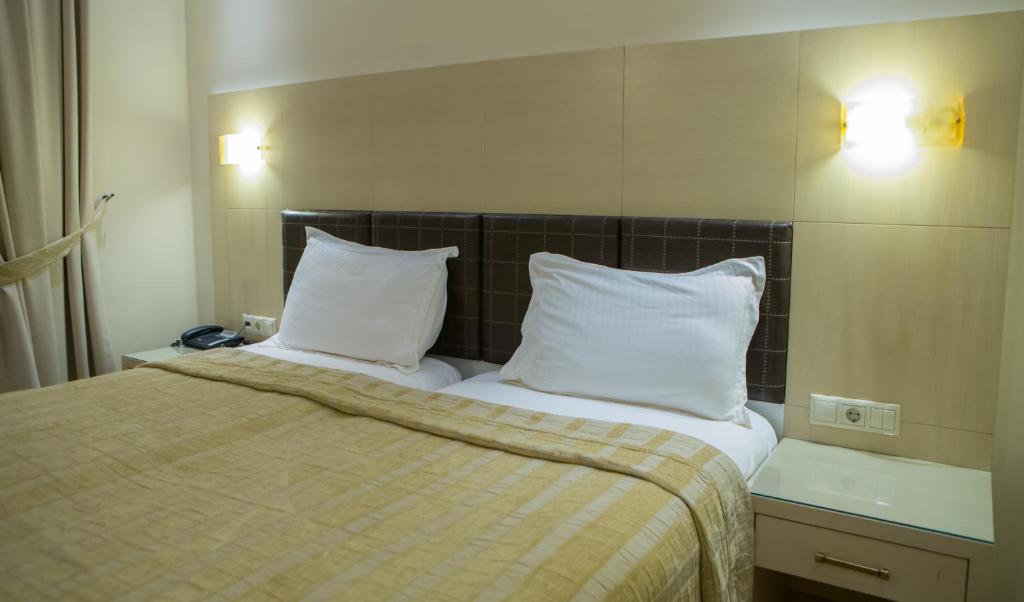 Postel nebo postele na pokoji v ubytování Pantelidis Hotel & Spa