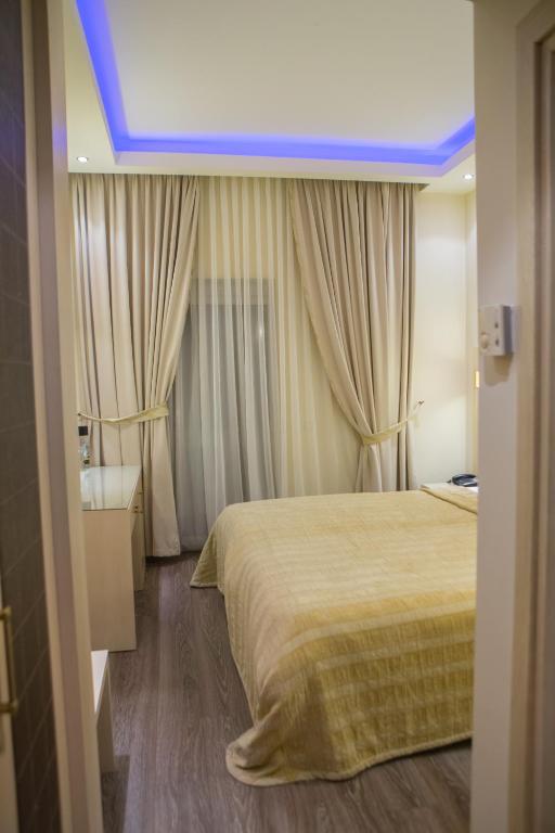 Postel nebo postele na pokoji v ubytování Pantelidis Hotel & Spa