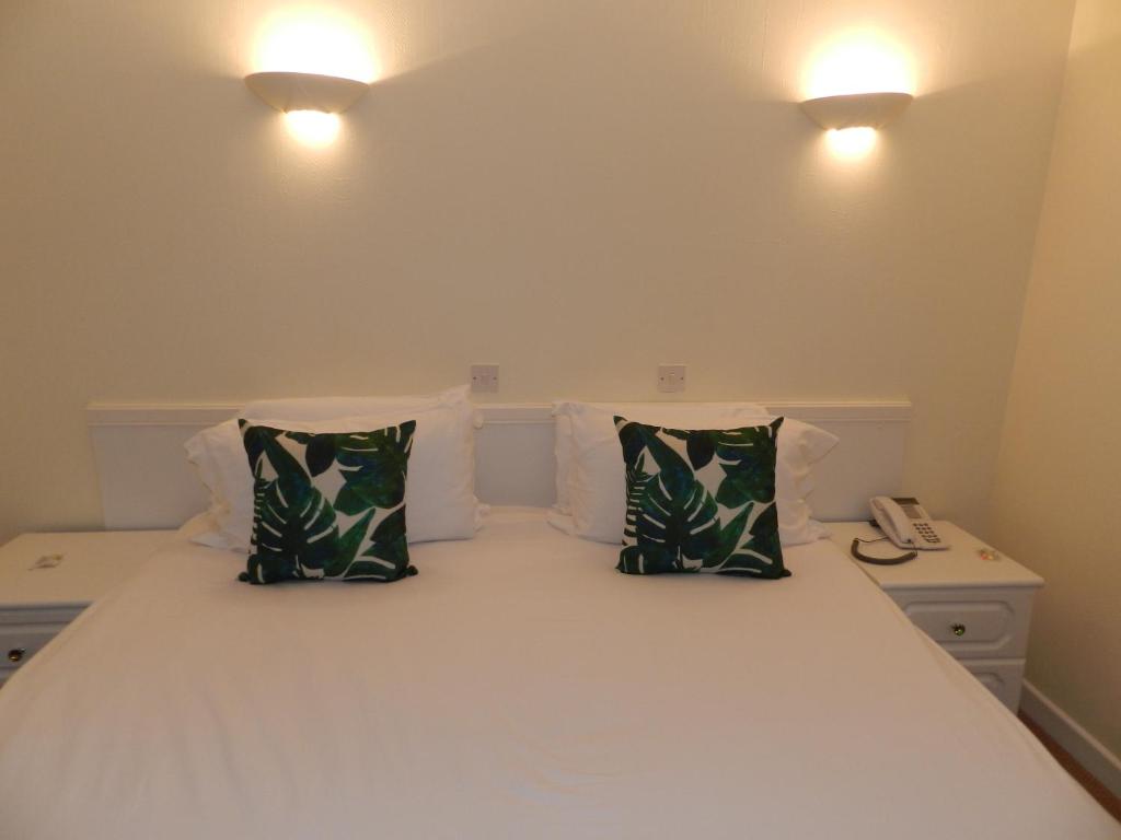 Letto o letti in una camera di Beau Rivage