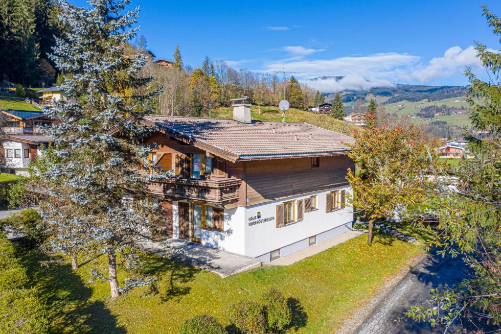 an aerial view of a house with a roof at Haus Niederösterreich in Kirchberg in Tirol