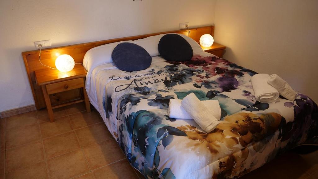 Postel nebo postele na pokoji v ubytování Apartaments Fontalba