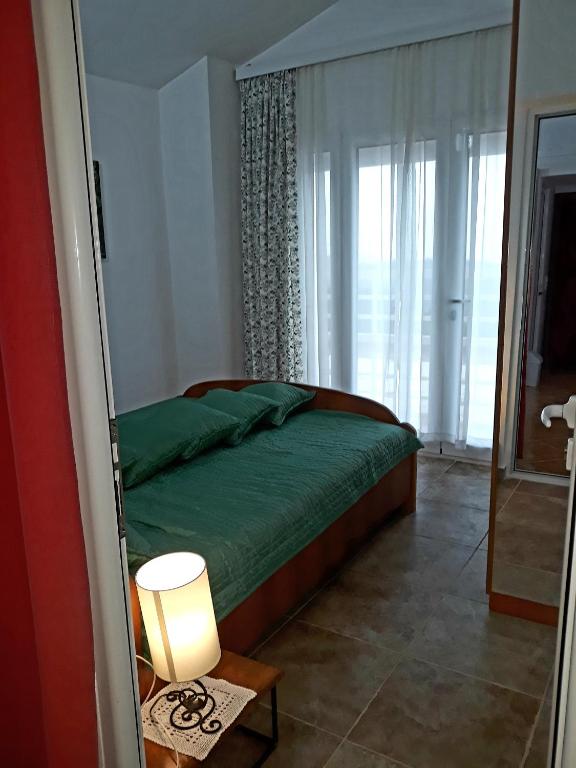 Postel nebo postele na pokoji v ubytování Apartments Jovanic with 2 bedrooms