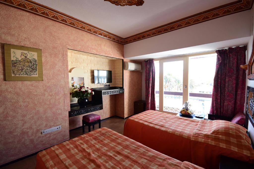 Postel nebo postele na pokoji v ubytování Sud Bahia Agadir "Bahia City Hotel"