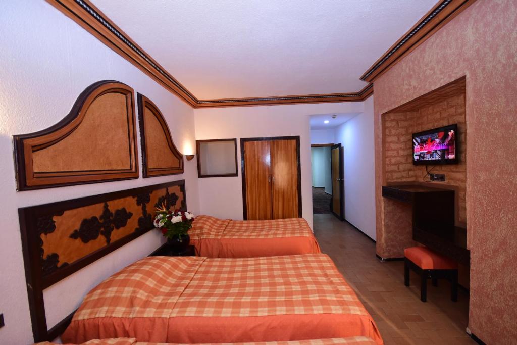 Postel nebo postele na pokoji v ubytování Sud Bahia Agadir "Bahia City Hotel"