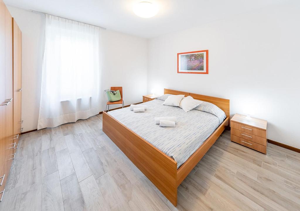 Łóżko lub łóżka w pokoju w obiekcie Appartamenti Pratone