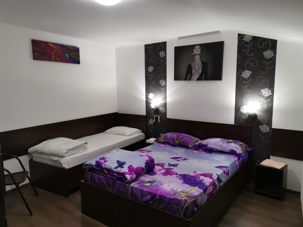 Postel nebo postele na pokoji v ubytování Joe Hostel