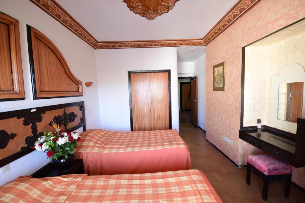Postel nebo postele na pokoji v ubytování Sud Bahia Agadir "Bahia City Hotel"